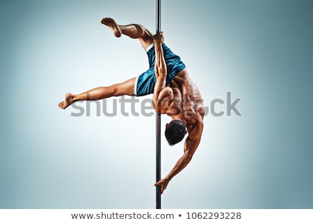 Foto stock: Young Strong Pole Dance Man