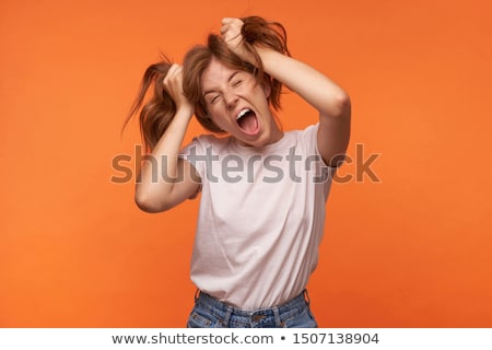 Foto d'archivio: Photo Of Beautiful Woman 20s With Curly Hair Having Fun And Hold