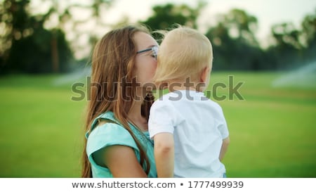 Stock photo: Lifestyle Portrait Of Cute Caucasian Girls Sisters Holding Littl