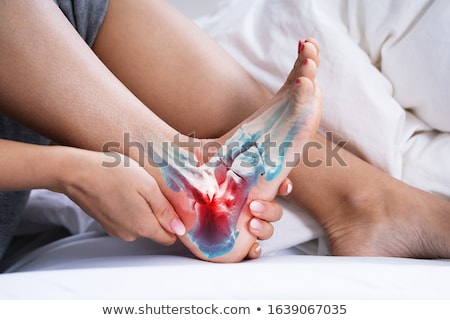 Foto stock: Woman Feeling Achilles Heel Pain