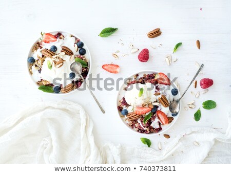 Foto stock: Yogurt On A Spoon Over A Yogurt Dessert