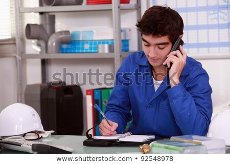 [[stock_photo]]: Construction Worker Arranging An Appointment