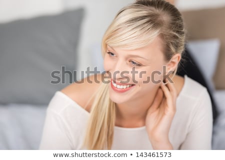 Stockfoto: Beautiful Young Woman Looking Up Smiling Relaxing And Day Dreami