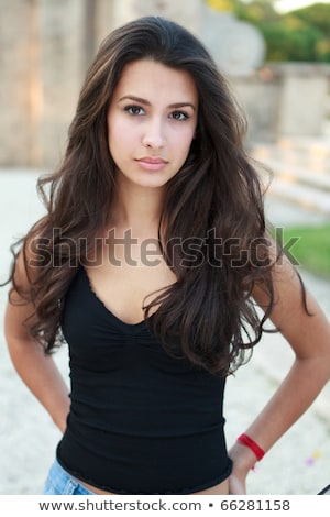 ストックフォト: Portrait Of A Seriuos Beautiful Woman With Long Brown Hair