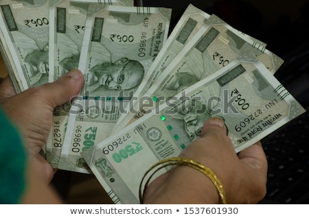 Stockfoto: Woman Holding Indian Paper Currency