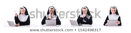 Foto d'archivio: Nun Working On Laptop - Religious Concept