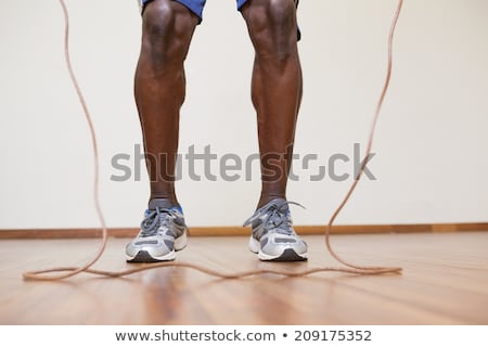 Сток-фото: The Legs Of Muscular Man With Skipping Rope