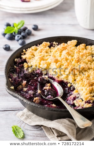 Foto stock: Coconut Crumble In Cast Iron Pan