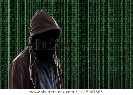 Сток-фото: Hacker Man In Hood With Face In A Darkness With Digital Numbers