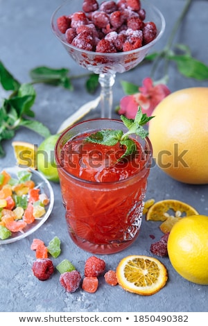 Сток-фото: Raspberry And Mint Leaf On A Frozen Slice Of Orange