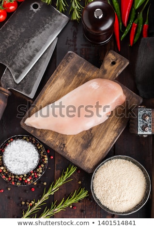 Stok fotoğraf: Fresh Raw Organic Chicken Fillet Breast On Vintage Board With Meat Hatchets And Spices With Herbs On