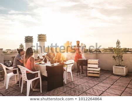 Stock photo: Happy Friends With Drinks Or Bbq Party On Rooftop