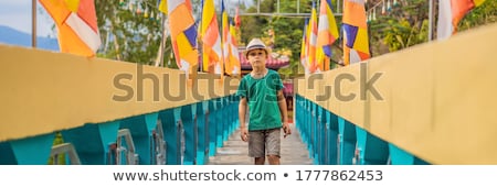 [[stock_photo]]: Boy Tourist In Buddhist Temple In Vietnam Nha Trang