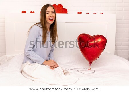 Stockfoto: Portrait Of Young Beautiful Awake Woman With Gifts On Bed At Bed