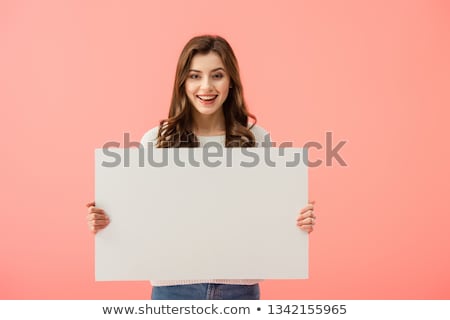 Stok fotoğraf: Young Woman In Casual Clothing Holding Empty Board