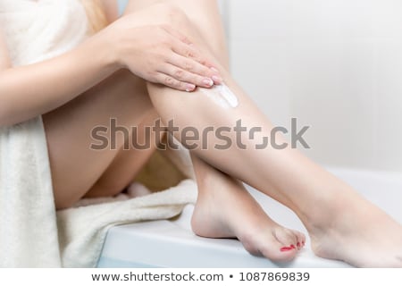 Zdjęcia stock: Pretty Young Woman Using Body Milk