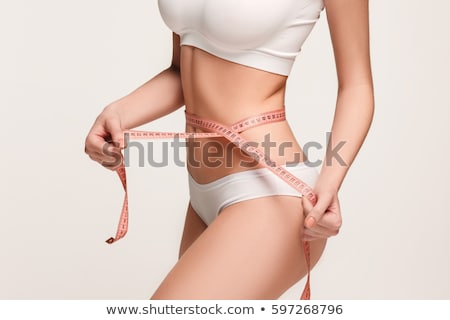 Foto stock: Fitness Woman With Measure Tape