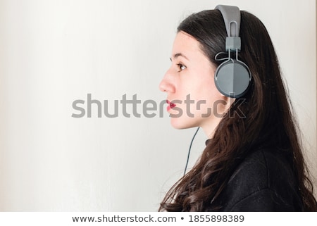 Сток-фото: White Noise Brunette With Headphones