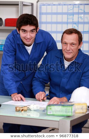 Stock foto: Two Factory Workers Checking Inventory