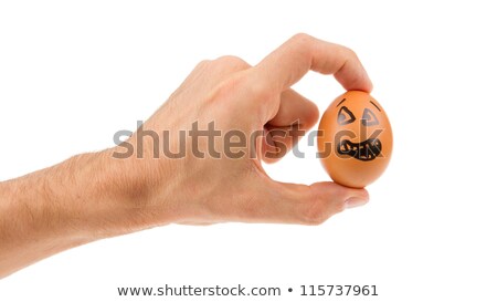 Zdjęcia stock: Scared Egg Waiting To Be Grabbed By A Hand