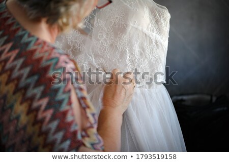 Stockfoto: Beautiful Young Bride Last Preparations For The Wedding