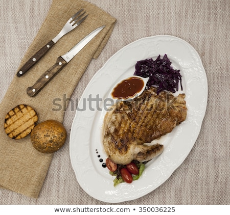 Stok fotoğraf: Juicy Roast Chicken With Vegetables And Ketchup Served On Porcelain Plate On A Tablecloth With Fork