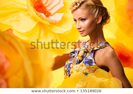 Stockfoto: Blond Woman In White Dress With Big Yellow Flower