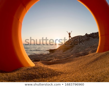 Stock fotó: Orange Buoy Stands In Sand On Beach