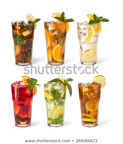Foto stock: Glass Of Iced Tea With Ice Cubes Lime And Mint