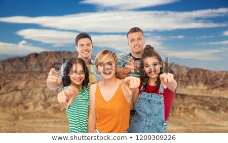 Stockfoto: Happy Friends Pointing At You Over Grand Canyon