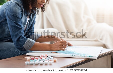 Stok fotoğraf: Woman Drawing Picture With Brush
