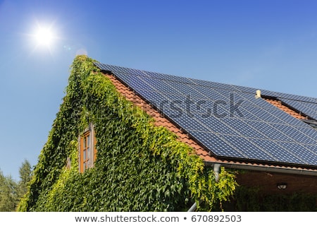 Stock fotó: Solar Panels On Red House Rooftop