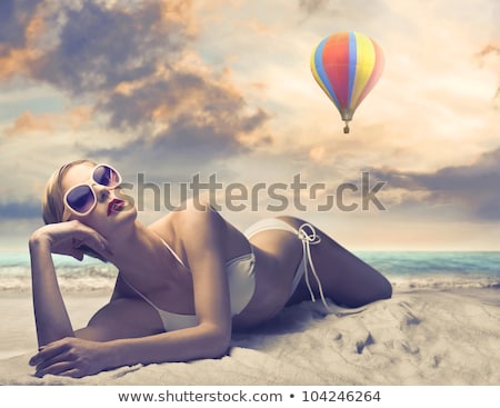 Foto d'archivio: Woman In Bikini Swimsuit With Air Balloons