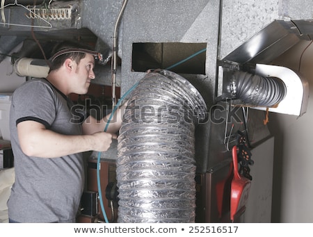 Foto stock: Ventilation Cleaner Man At Work With Tool