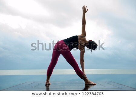 Foto stock: Yoga Woman On Cloudy Landscape