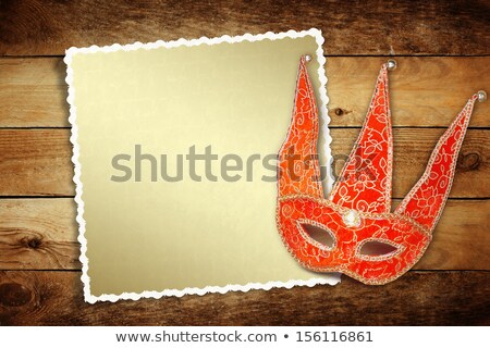 [[stock_photo]]: Carnival Red Mask With Old Paper For Greeting On Wooden Backgrou