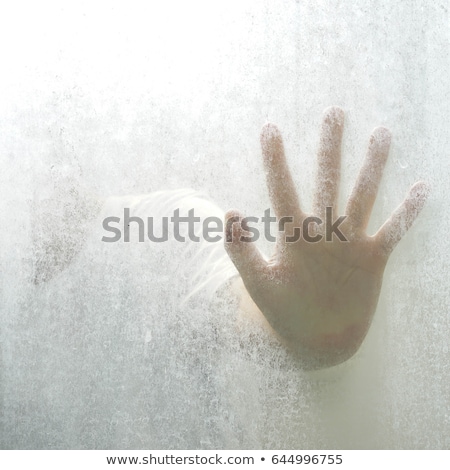 Stok fotoğraf: Trapped Man Back Lit Silhouette Of Hands Behind Matte Glass