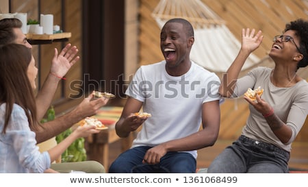 Stockfoto: Teenage Friends Sitting At Table And Having Fun Outdoors