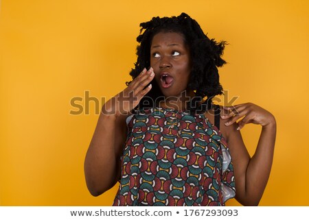 Stock photo: Woman With Shocked Facial Expression Looking And Pointing Down