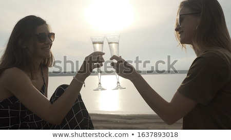 [[stock_photo]]: Close Up Of Lesbian Couple With Champagne Glasses