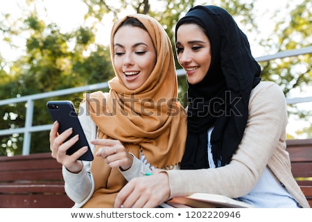 Stock foto: Photo Of Cheerful Islamic Girls Wearing Headscarfs Studying In