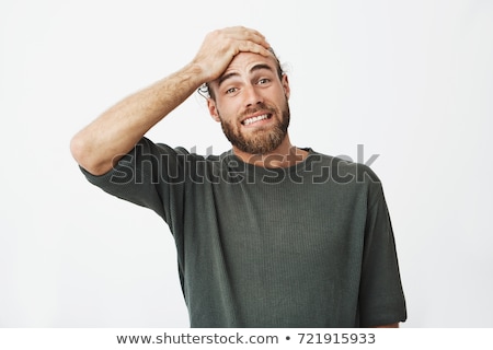 Foto stock: Attractive Man Holding His Hand At The Forehead