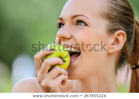 Foto stock: Beautiful Blonde Girl With Fresh Green Apple