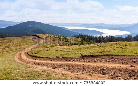 Stockfoto: Dirt Road In A Rural Landscape