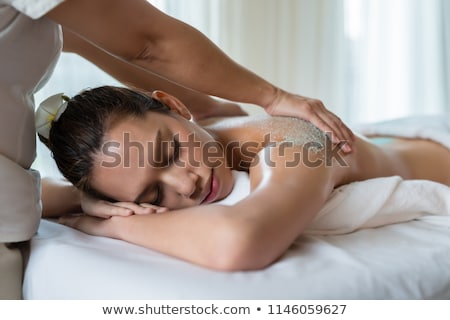 Foto d'archivio: Woman Sleeping With Salt Scrub On The Back