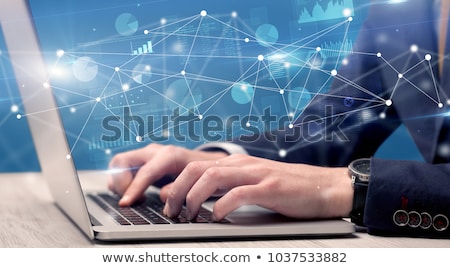 [[stock_photo]]: Hand Typing On Laptop With Linked Report And Charts Around