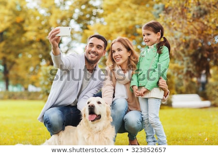 Stockfoto: Happy Family With Dog Taking Selfie In Autumn
