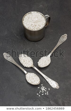 Stock photo: Polished Long Rice Grains In Metal Spoon