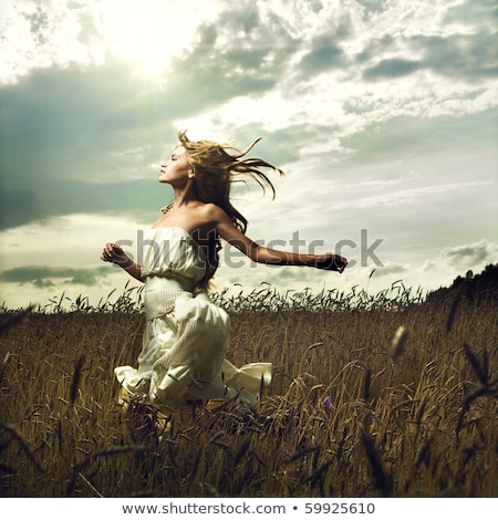 Stock foto: Beautiful Woman On A Field In Summertime