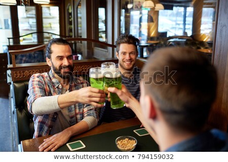 Foto stock: Happy St Patricks Day Glasses Of Green And Draft Beer